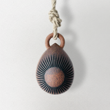 Tucker seed bell, sun and crescent